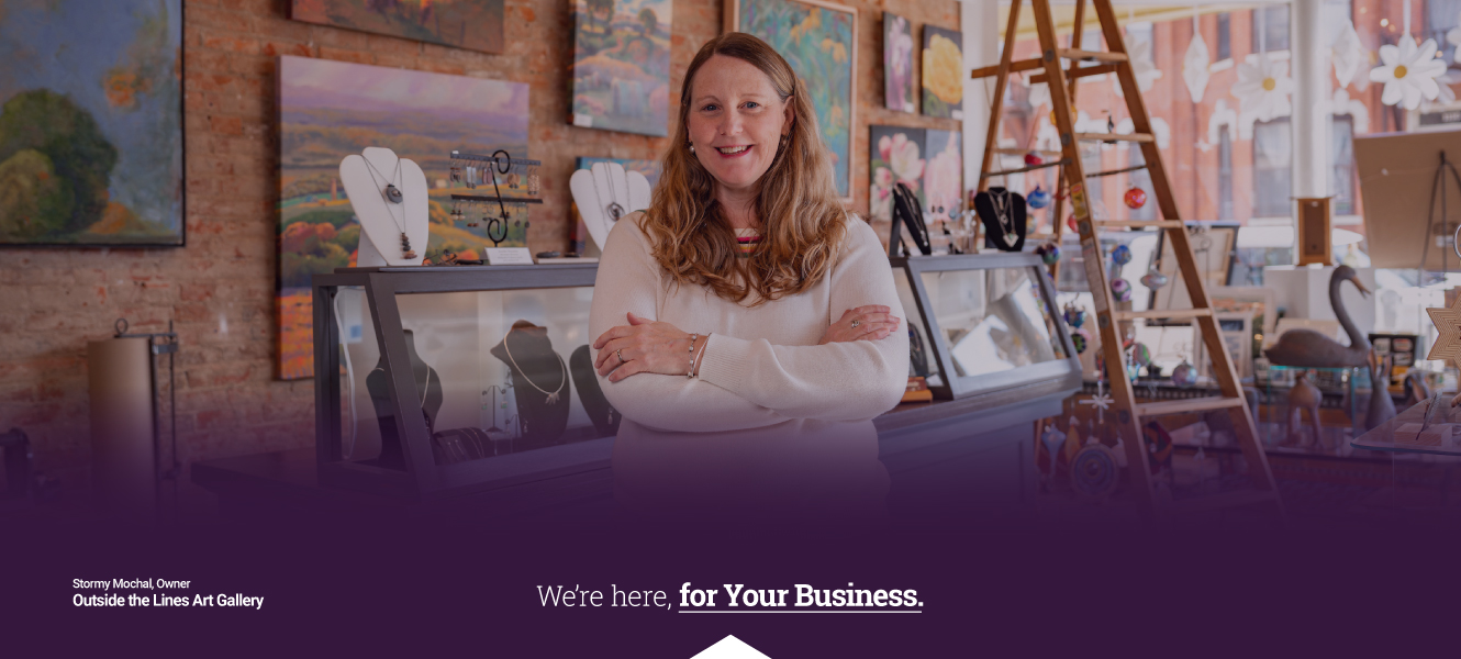 Stormy Mochal, owner of Outside the Lines Gallery poses in her shop.