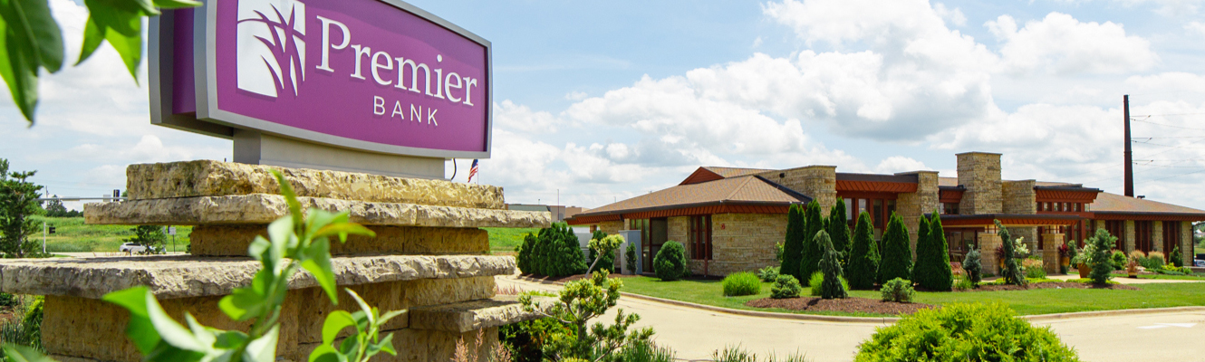 Photo of Premier Bank's Northwest Arterial Branch on a summer day