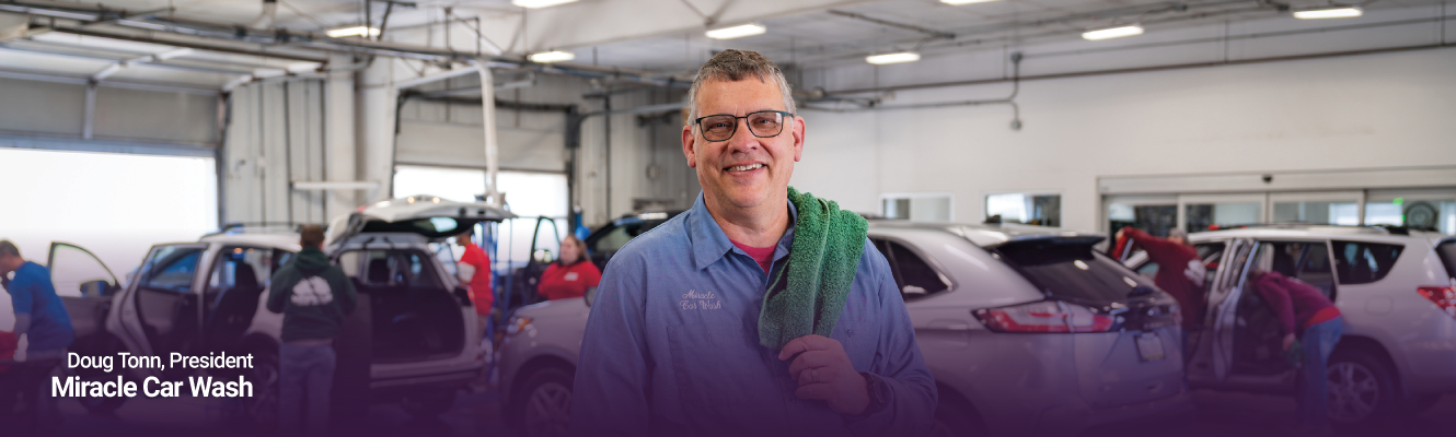 Header image with Doug Tonn Owner of Miracle Car Wash standing in his business.